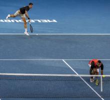 Nick Kyrgios and Thanasi Kokkinakis in action playing tennis doubles